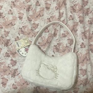 Hello everyone and welcome to my page,  I am selling A faux fur shoulder bag